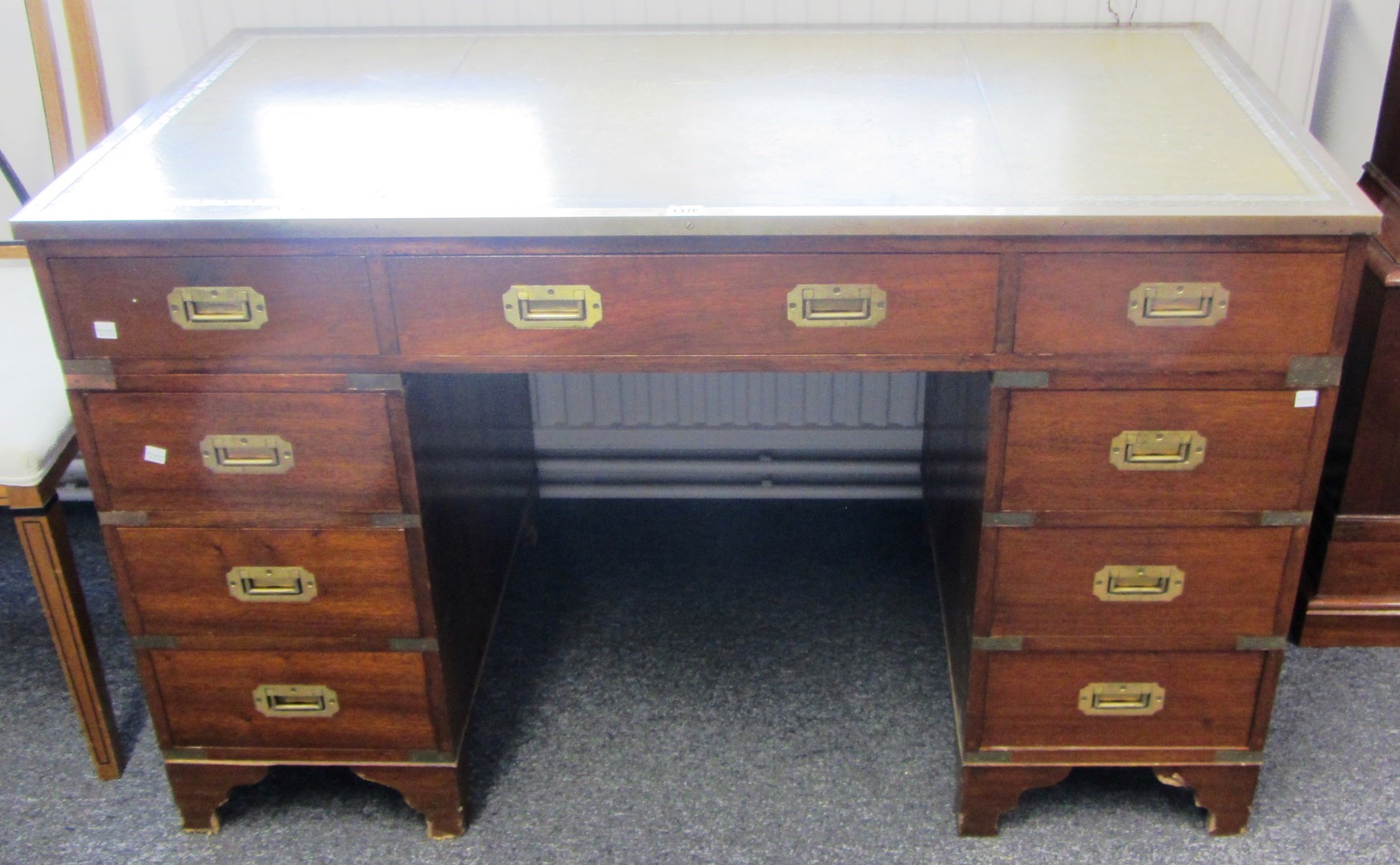 Appraisal: A th century brass mounted mahogany campaign style nine drawer