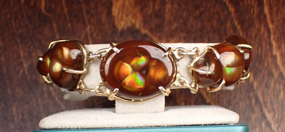 Appraisal: MEXICAN FIRE AGATE AND FOURTEEN KARAT GOLD BRACELET The -