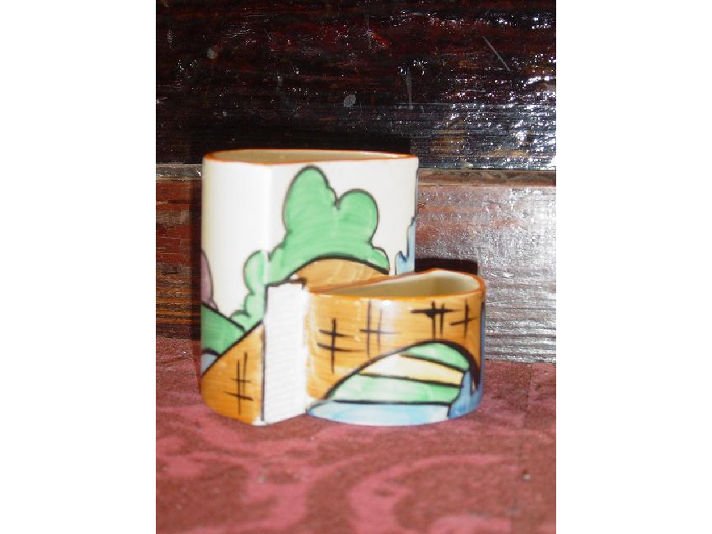 Appraisal: A Clarice Cliff Bizarre cigarette and match holder match striker