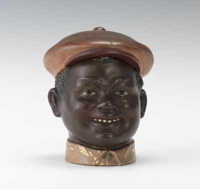 Appraisal: Black Boy Page Head Tobacco Jar Terracotta with polychrome smiling