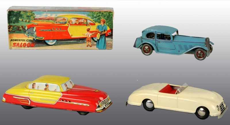 Appraisal: Lot of Tin Automobile Toys Description English Circa s Working