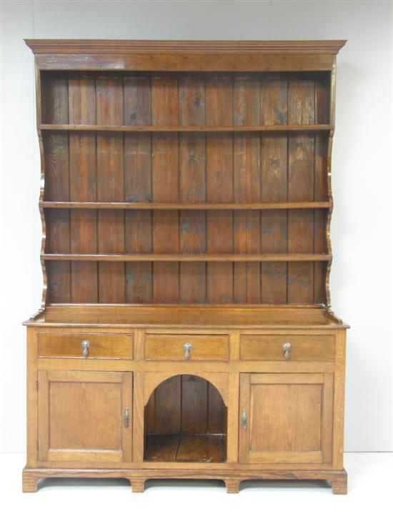 Appraisal: th century oak dresser with three-tier plate rack over three