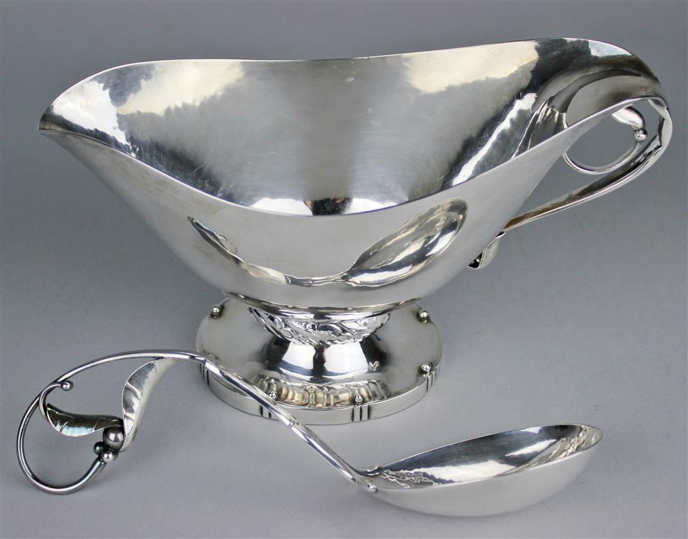 Appraisal: GEORG JENSEN STERLING 'BLOSSOM' SAUCEBOAT AND LADLE POST both impressed