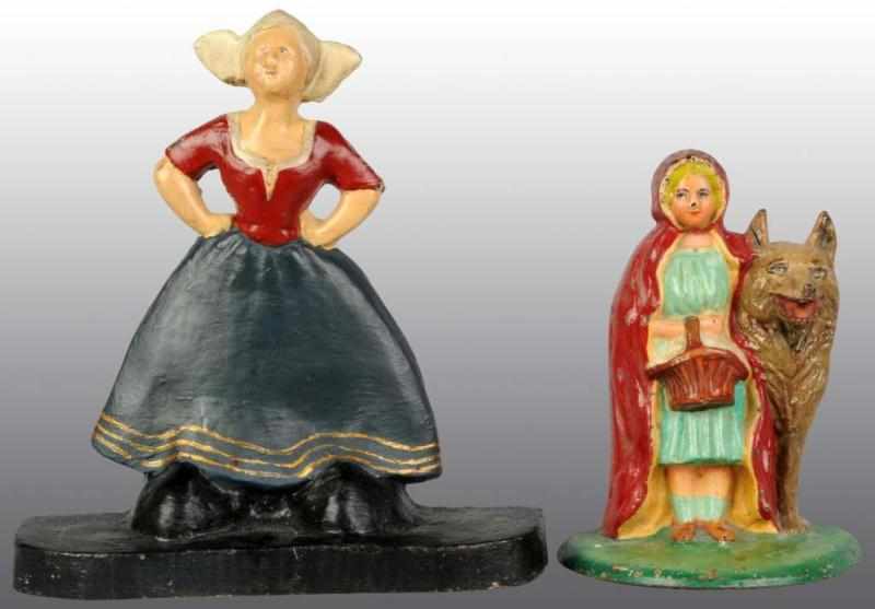 Appraisal: Lot of Cast Iron Doorstops Description Dutch girl with oversized