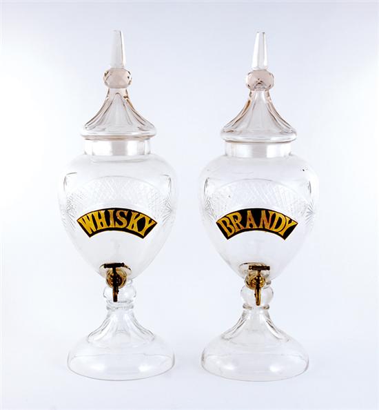 Appraisal: Two cut-glass liquor dispensers urn form with steepled lid labeled