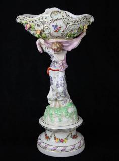 Appraisal: German porcelain figural centerpiece German porcelain figural centerpiece the reticulated