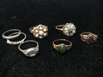 Appraisal: Eight piece lady's gold rings Three set with opals one