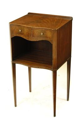 Appraisal: A mahogany serpentine front bedside table inlaid stringing and with