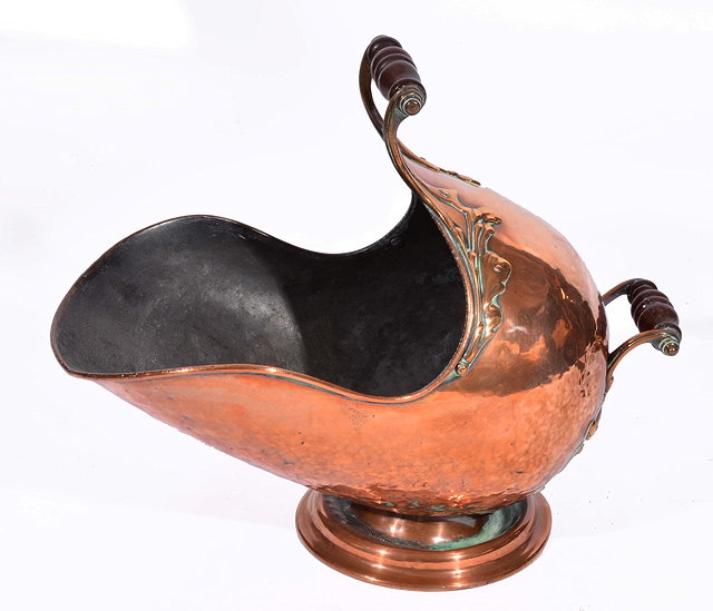 Appraisal: AN EARLY VICTORIAN BURNISHED COPPER HELMET SHAPED COAL SCUTTLE with