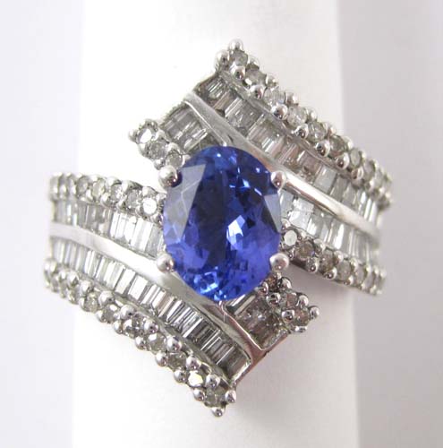 Appraisal: TANZANITE DIAMOND AND FOURTEEN KARAT WHITE GOLD RING with round-cut