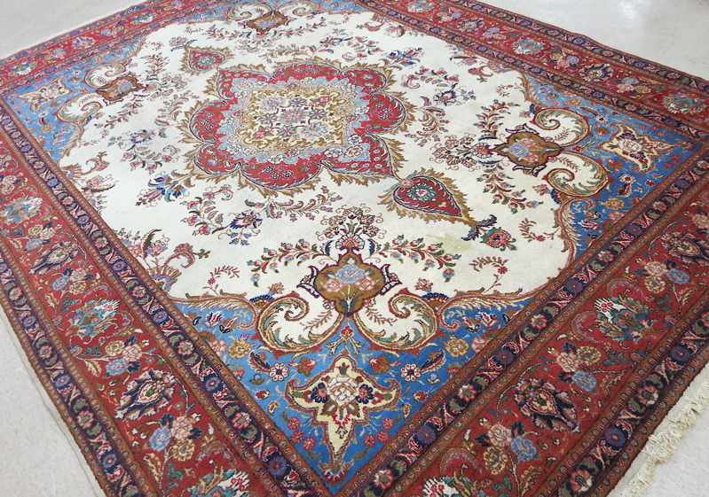 Appraisal: SEMI-ANTIQUE PERSIAN CARPET floral and central floral medallion design on