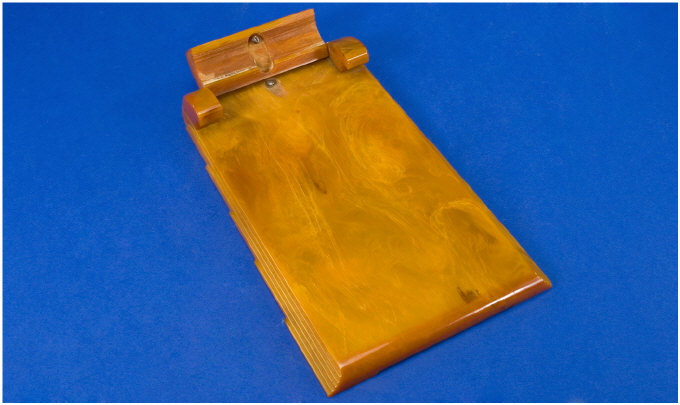 Appraisal: Art Deco Amber Coloured Bakelite Notepad Holder Impressed Mark Carvacraft