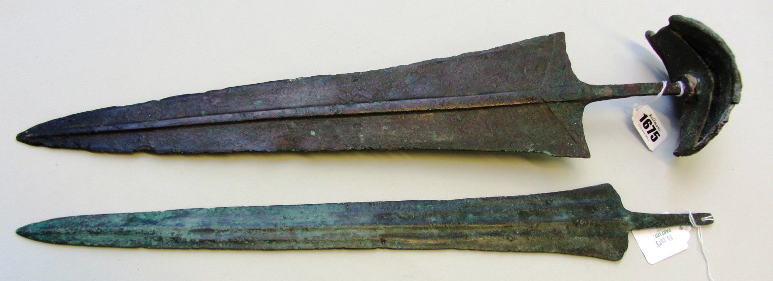 Appraisal: Two Luristan bronze weapons one a large leaf shaped dagger