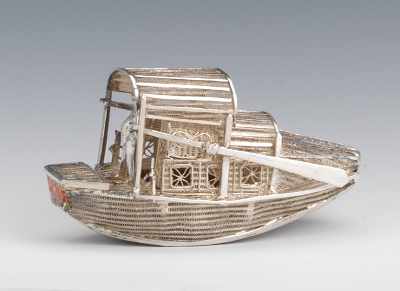 Appraisal: A Chinese Silver Miniature River Boat With a lone figure