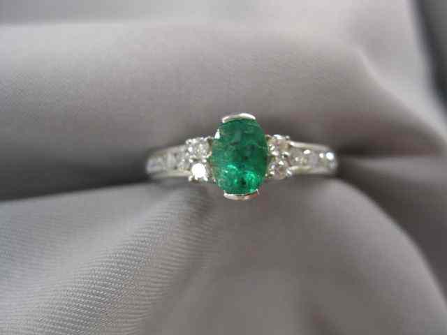 Appraisal: Emerald Diamond Ring oval gem weighing carat with diamonds on