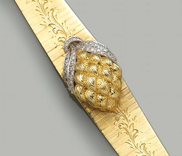 Appraisal: A quartz diamond eighteen and fourteen karat gold covered dial