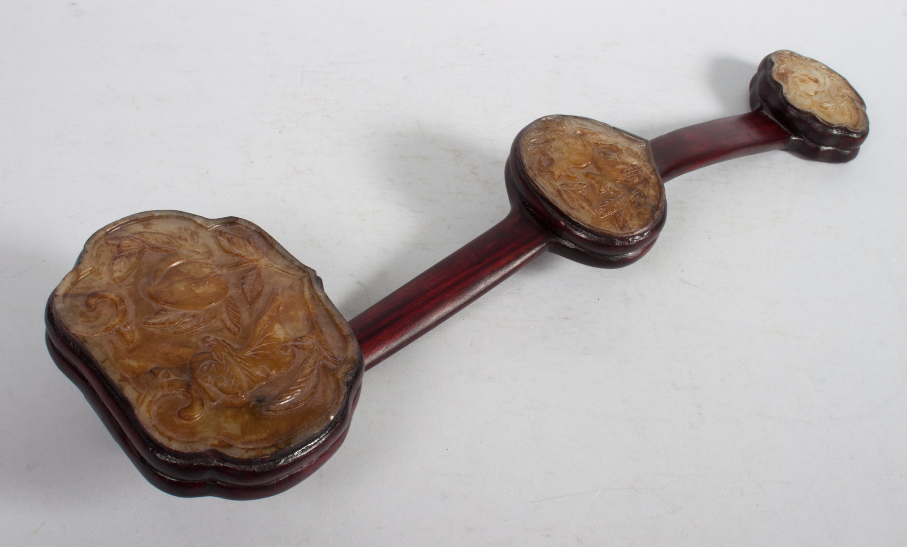 Appraisal: Chinese carved jade and wood ruyi scepter carved wood shaft