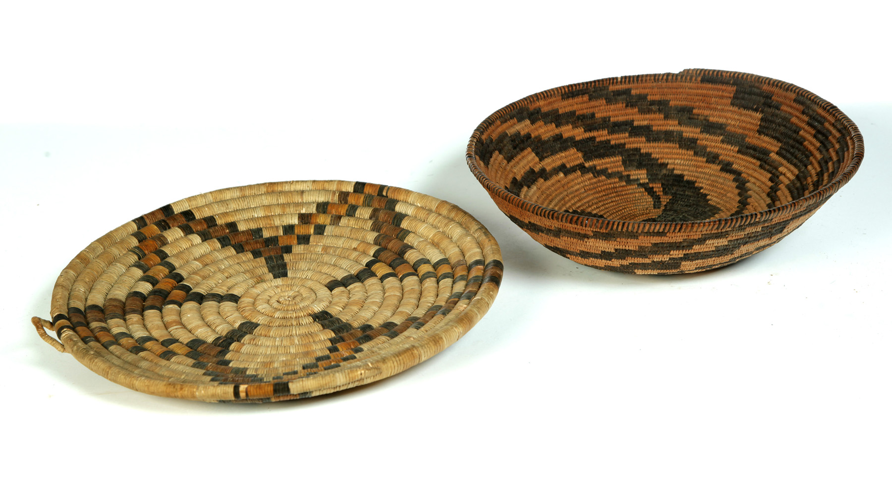 Appraisal: TWO NATIVE AMERICAN INDIAN BASKETS Twentieth century Nicely woven in