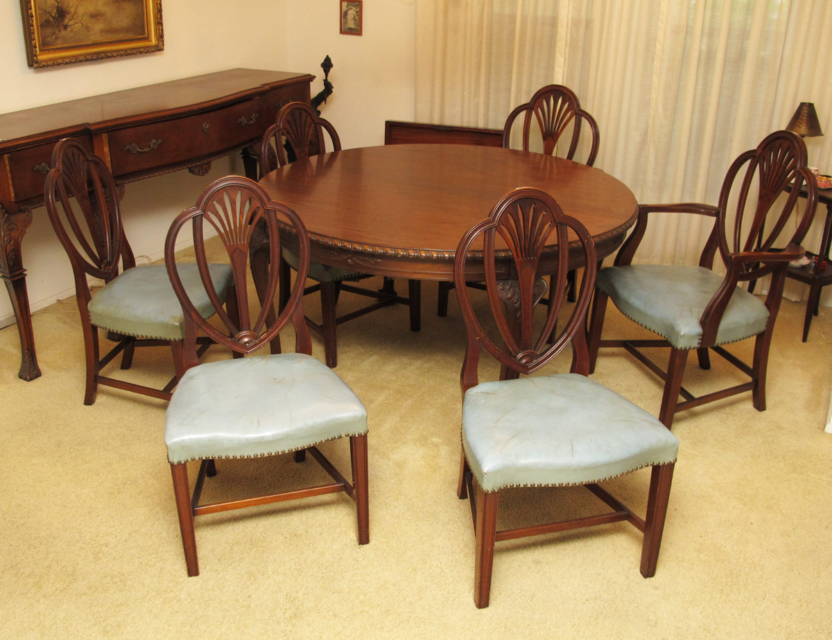 Appraisal: WELL CARVED MAHOGANY ROUND DINING TABLE AND CHAIRS Table with