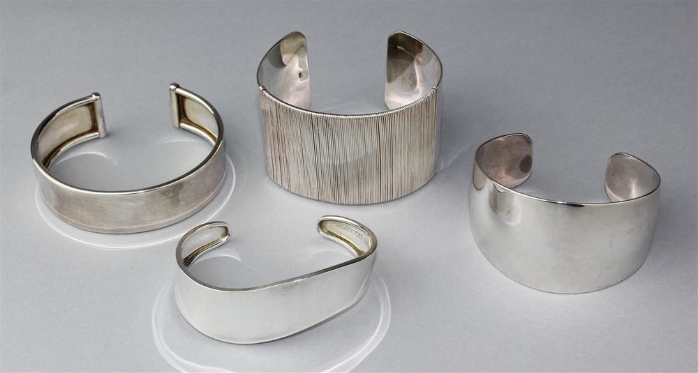 Appraisal: TWO PURE SILVER CUFFS AND TWO STERLING CUFFS the first