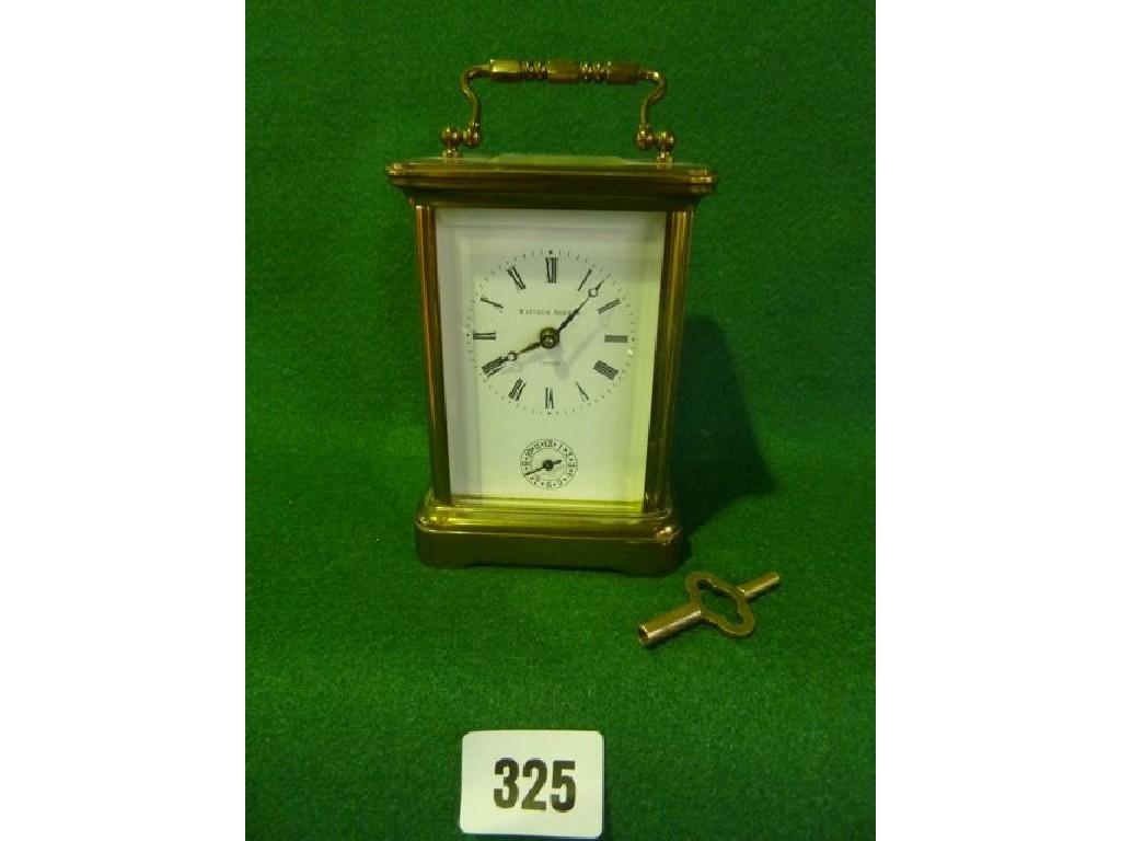 Appraisal: A traditional carriage clock with brass case Mathew Norman movement