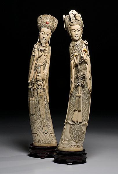 Appraisal: PAIR OF ASIAN IVORY TUSK FIGURES late th century male