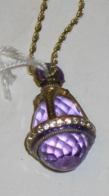 Appraisal: A GLASS PENDANT of purple faceted pear form in gilded