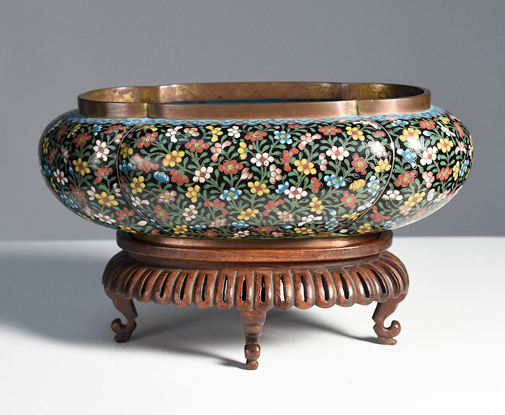 Appraisal: Chinese cloisonn planter on carved rosewood base Chinese cloisonn planter