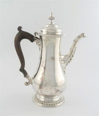 Appraisal: A George III baluster coffee pot with gadrooned borders domed