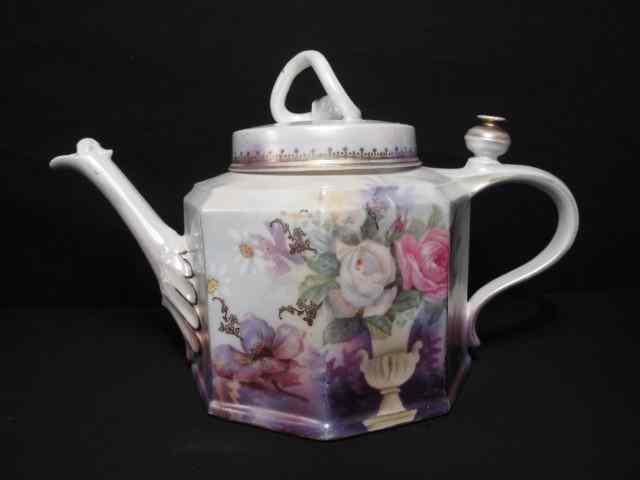 Appraisal: RS Prussia floral porcelain painted teapot Decorative floral rose painting