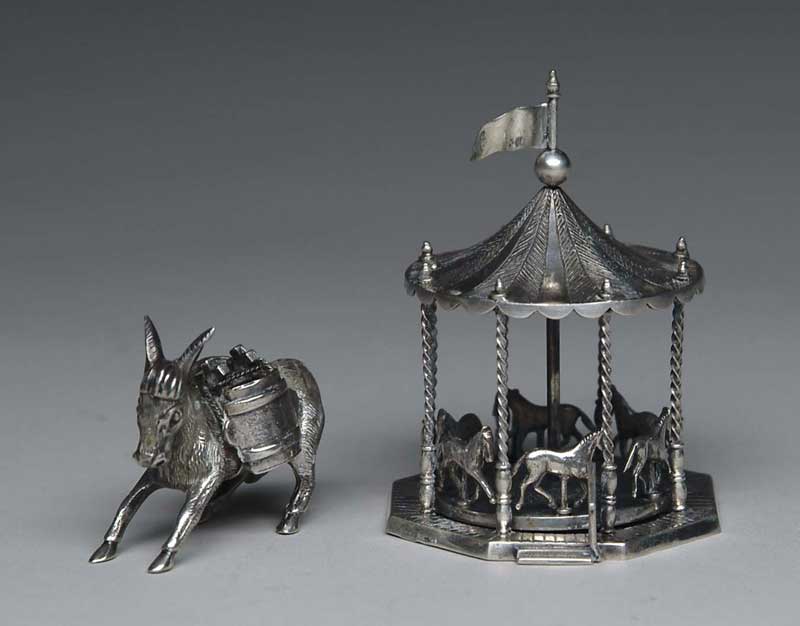 Appraisal: INTERESTING SILVER ROTATING CAROUSEL AND DONKEY - h carousel has