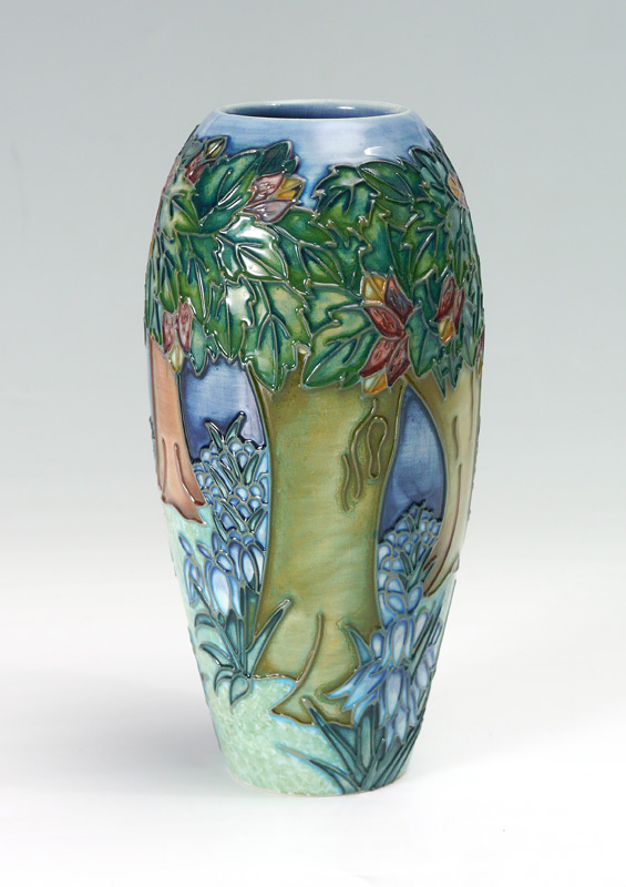 Appraisal: MOORCROFT TREES LANDSCAPE VASE Decorated with raised forest and flowers