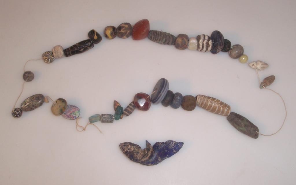 Appraisal: A string of thirty-four assorted ancient glass faience and stone