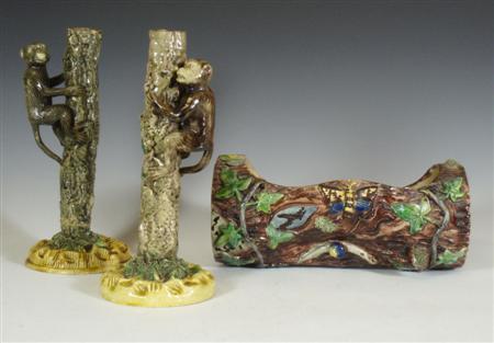 Appraisal: Two similar Portuguese Palissy candlesticks each decorated with a monkey