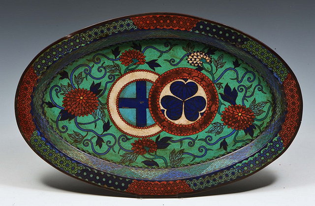 Appraisal: A JAPANESE CLOISONNE OVAL DISH with two emblems and chrysanthemum