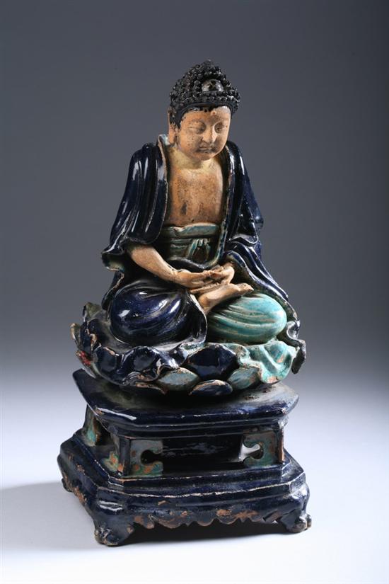 Appraisal: CHINESE SANCAI POTTERY FIGURE OF BUDDHA Ming Dynasty Seated in