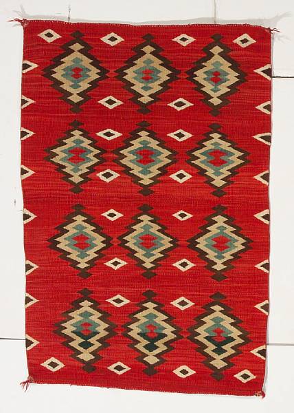 Appraisal: A Navajo transitional rug With three rows of concentric diamond