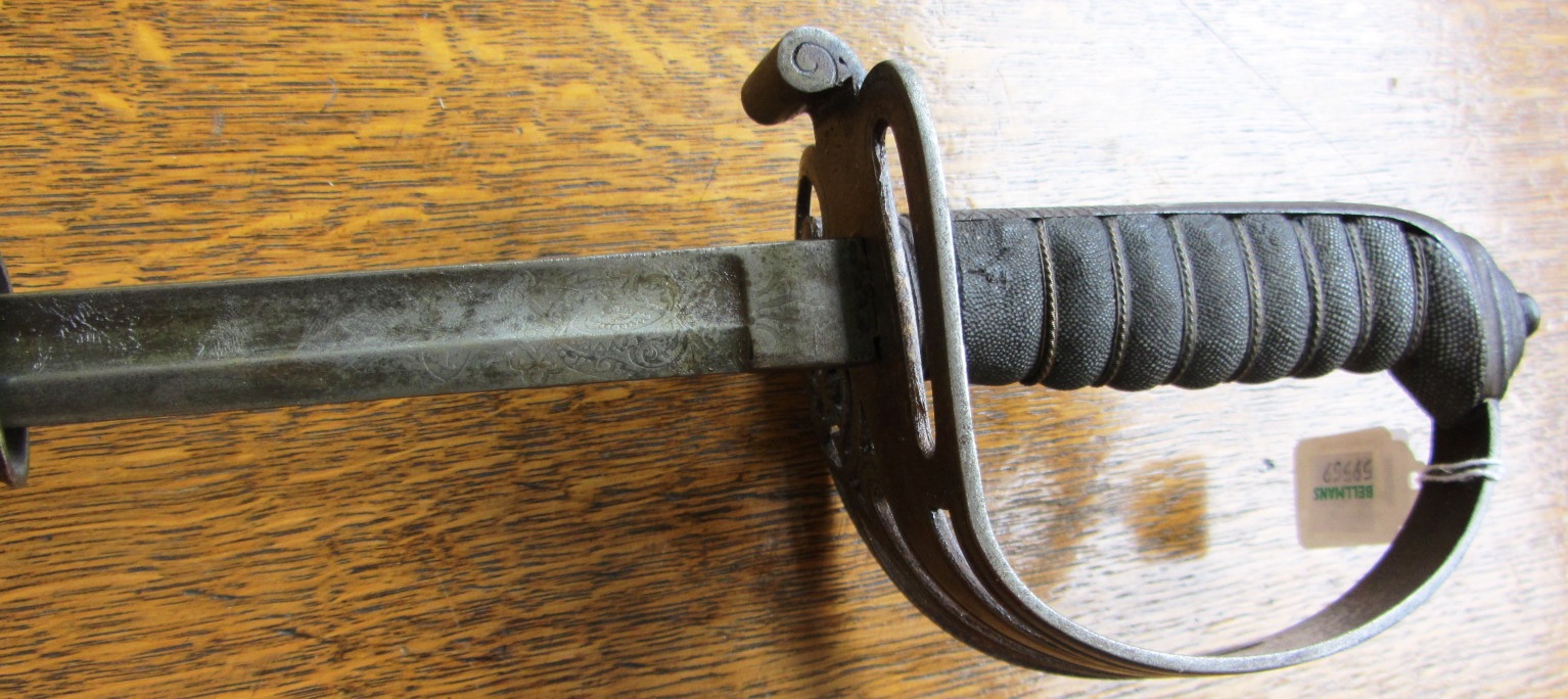 Appraisal: A Volunteer Rifles Officers sword with slightly curved engraved blade