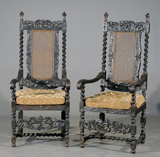 Appraisal: Pair Flemish carved oak high back armchairs late th centuryshaped