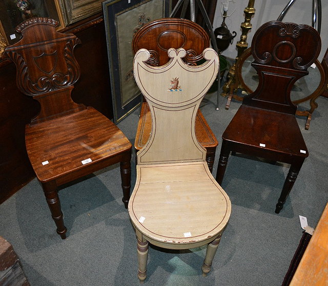 Appraisal: th Century painted hall chairwith heraldic crest and three th