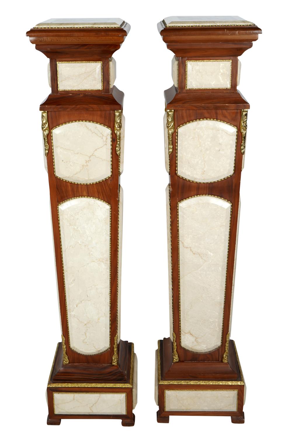 Appraisal: PAIR OF MAHOGANY PEDESTALSwith gilt metal mounts and inset stone