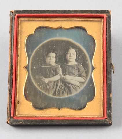 Appraisal: Sixth plate daguerreotype of two children in circular vignette Pad