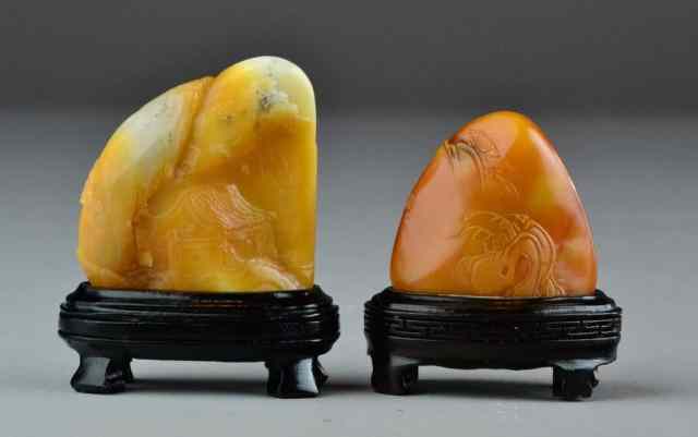 Appraisal: Chinese Qing Tianhuang Mountains with StandTwo Tianhuang stones of osmanthus-flower-yellow