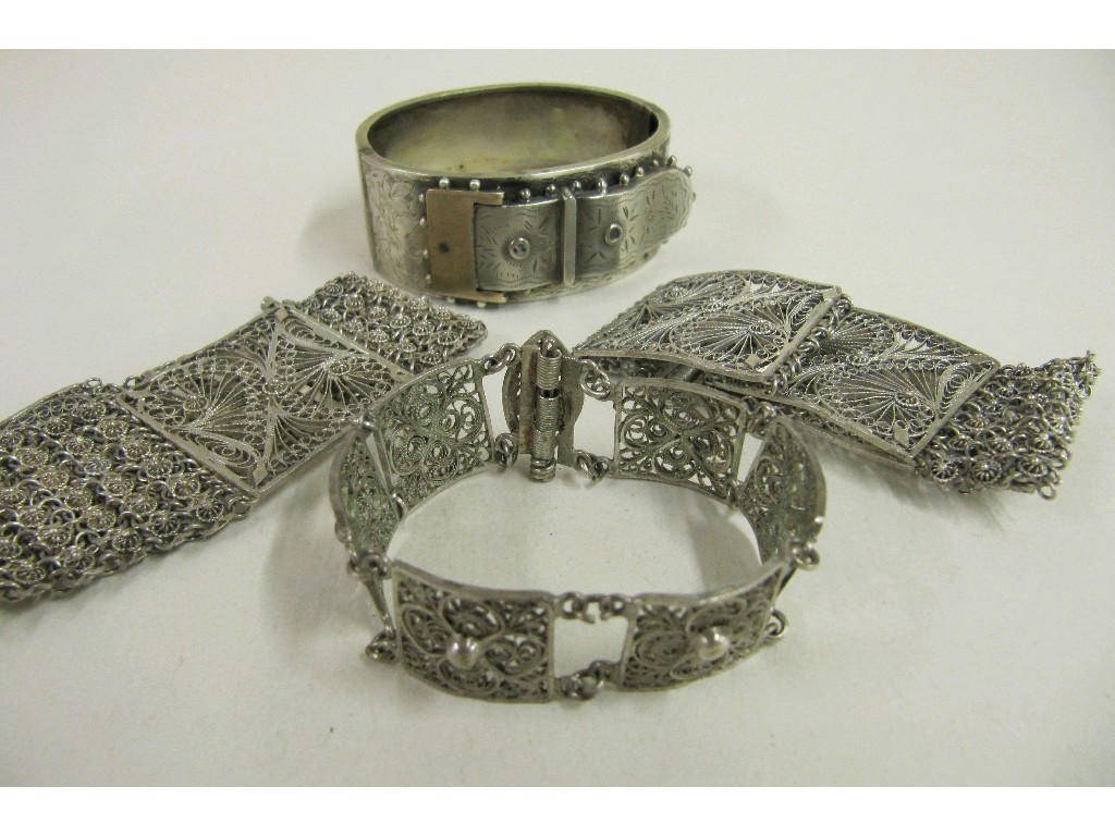 Appraisal: Three silver filigree bracelets and a Victorian silver bangle