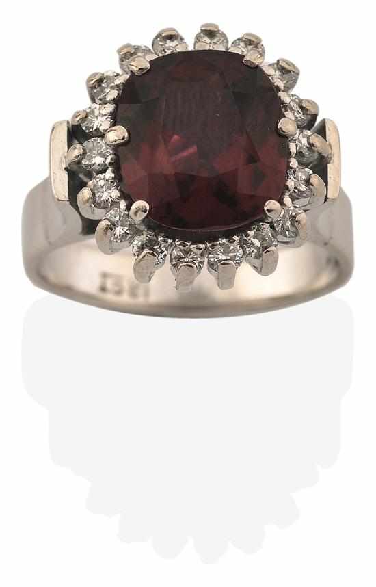 Appraisal: A RHODOLITE GARNET AND DIAMOND RING Of cluster design centrally