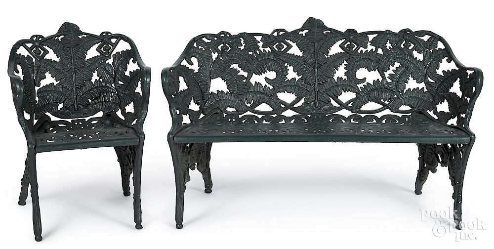 Appraisal: Two-piece cast iron fern pattern patio suite Two-piece cast iron