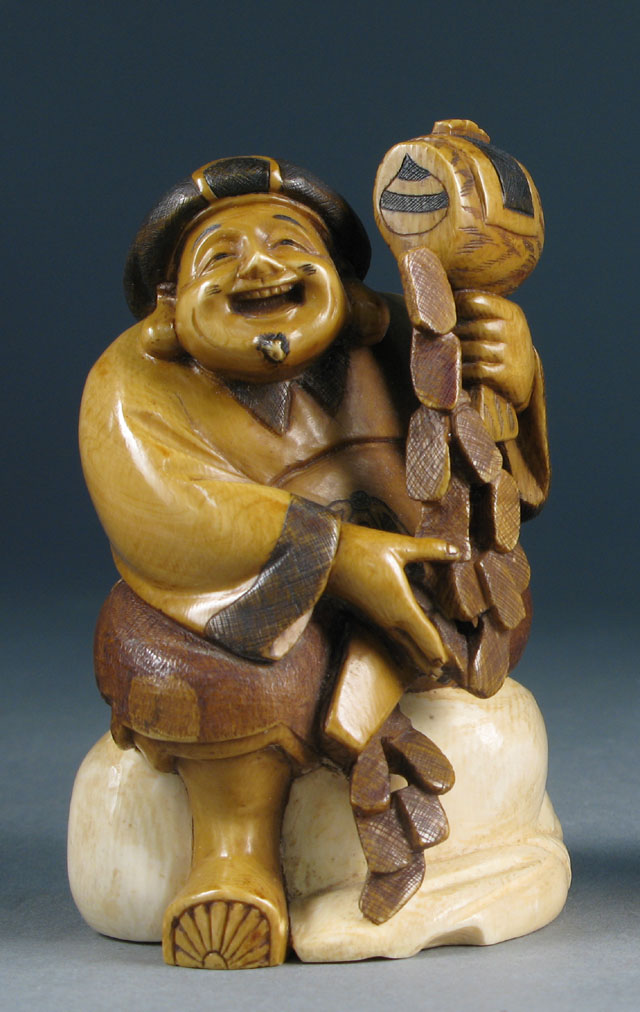 Appraisal: OKIMONO CARVED IVORY FIGURE OF A SMILING MAN standing holding