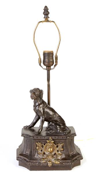 Appraisal: A pair of patinated and gilt metal dog form table