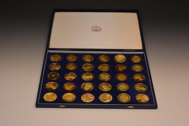 Appraisal: A collection of thirty gilt commemorative medallionsshowing great Britons including