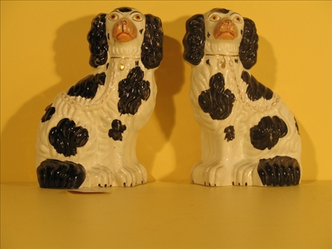 Appraisal: PAIR OF STAFFORDSHIRE MODELS OF BLACK AND WHITE SPANIELS Late